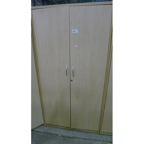 1131 - 1 tall  light wood effect two door storage cabinet