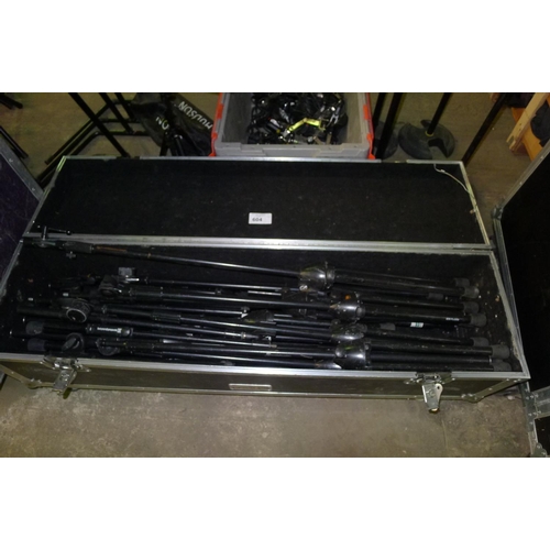 604 - 1 low wide flight case with hinged lid containing a quantity of various stands