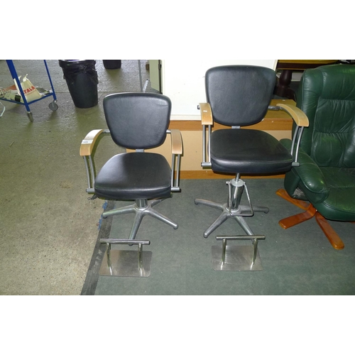 129 - 2 adjustable height hair salon chairs with 2 foot rests