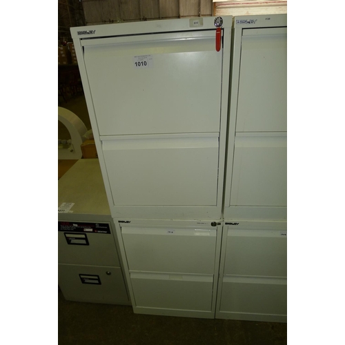 1010 - 2 white metal 2 drawer filing cabinets