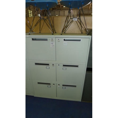 1152 - 1 light green metal six person personnel locker with post slot doors and supplied with all keys