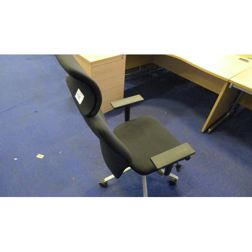 1182 - 1 black upholstered office swivel chair with head rest