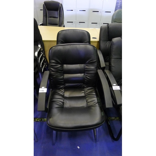 1192 - 2 black upholstered cantilever chairs