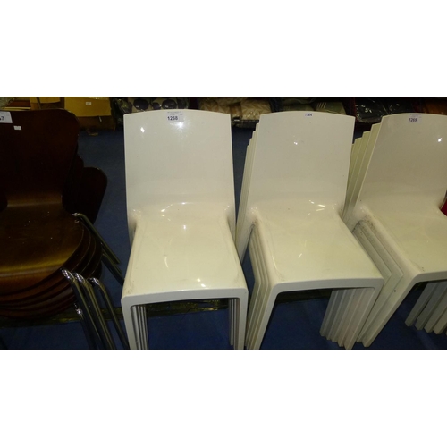 1268 - 10 white plastic stacking chairs