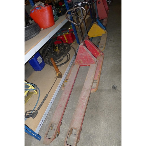 2067 - 1 long pallet truck (slightly bent) and 1 other pallet truck