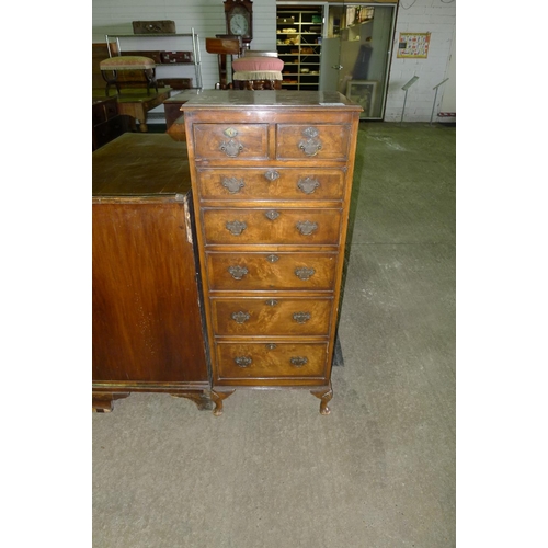 721 - A reproduction walnut and mahogany bedroom chest of 2 short and 5 long graduated drawers with drop h... 