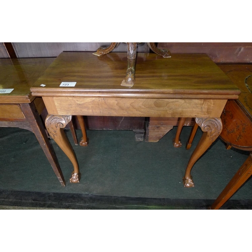 723 - A mahogany rectangular topped fold over tea table on cabriole legs with ball and claw feet