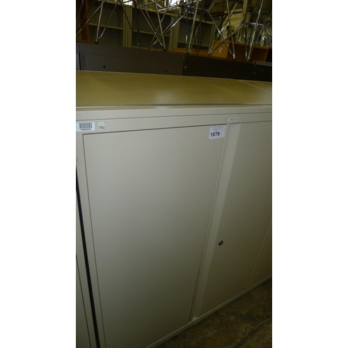 1076 - One light brown metal two door storage cabinet with sloping wood effect top -  medium-sized