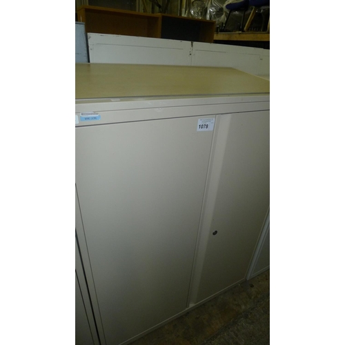 1078 - One light brown metal two door storage cabinet with sloping wood effect top -  medium-sized