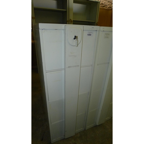 1080 - 1 light grey metal four drawer filing cabinet with locking front bar - supplied with 1 key