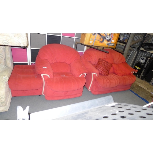 125 - One red upholstered two-person sofa with a matching armchair and footstool