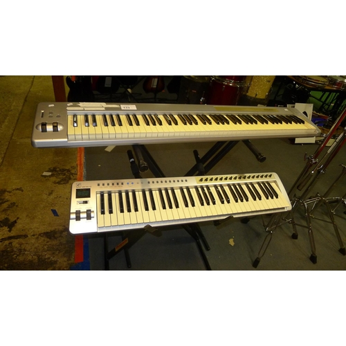 133 - 1 m-audio keystation keyboard with 61 keys and an Evolution MK361c with 49 keys both with stands tra... 