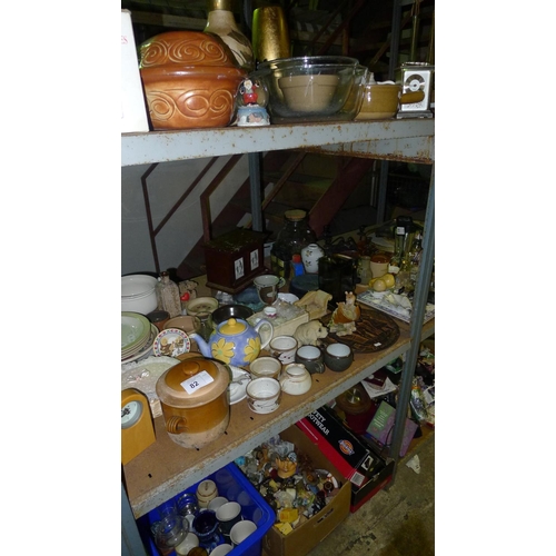 82 - A quantity of various items including crockery, ornaments etc. Contents of one bay / 3 shelves