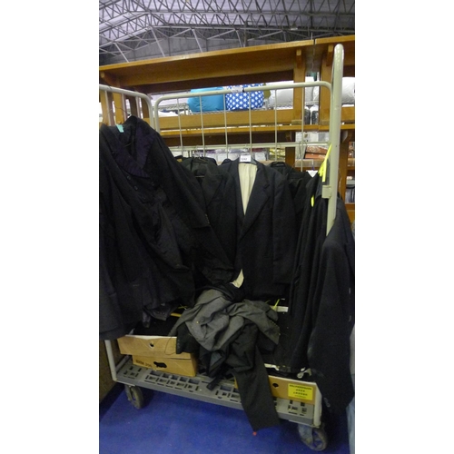 1242 - A quantity of various mens jackets, trousers etc. Contents of one wheeled cage which is not included