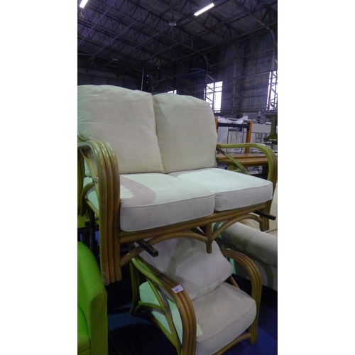 1246 - A bamboo framed two-person conservatory sofa with cream cushions and 1 matching chair