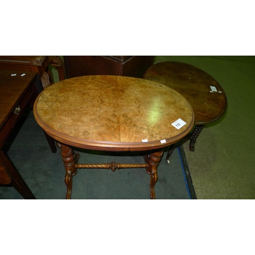 737 - An Edwardian walnut oval topped occasional table with twisted columns support and 4 scroll legs