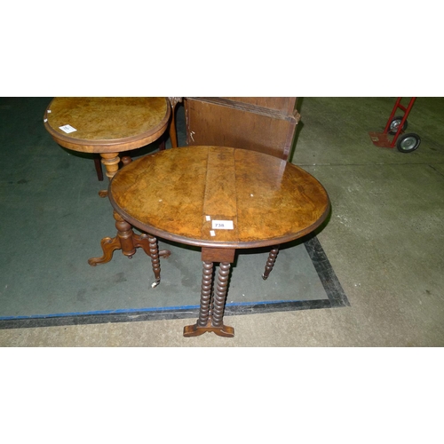 738 - An Edwardian walnut oval topped drop leaf Sutherland table with bobbin turned legs