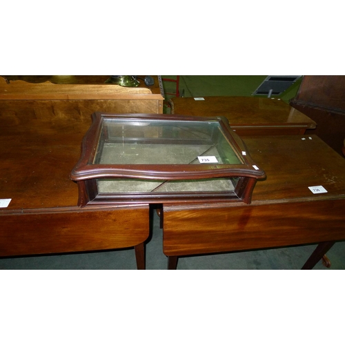 735 - A mahogany table top display cabinet with a glazed lift lid