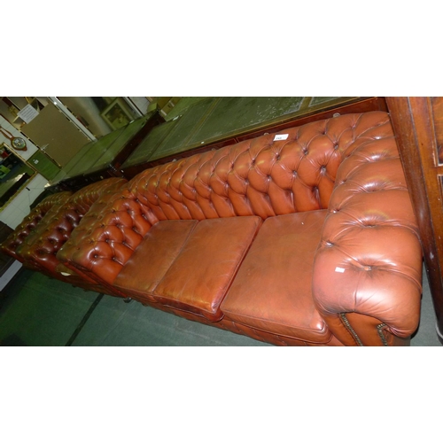 755 - A three-piece classic design button backed leather Chesterfield suite three-seater settee and two ma... 