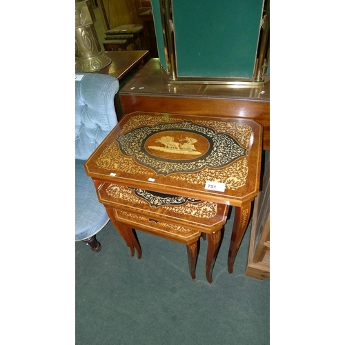 751 - A nest of three marquetry inlaid rectangular topped coffee tables