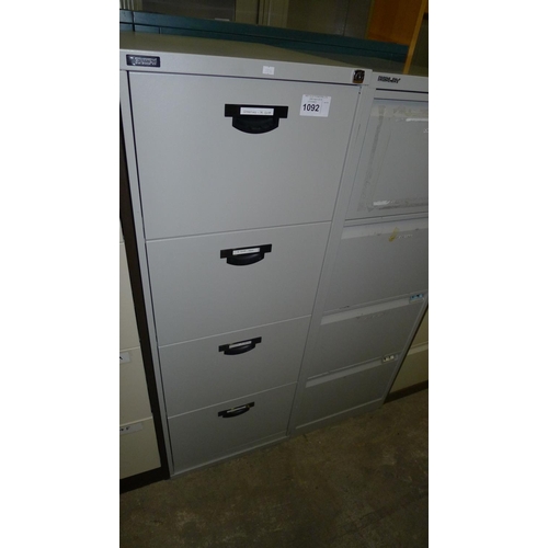 1092 - 1 grey metal 4 drawer filing cabinet