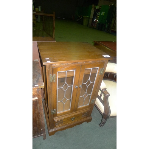 744 - Reproduction oak cabinet with 2 leaded glazed doors and 1 drawer under