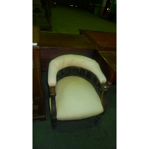 745 - An Edwardian cream upholstered tub chair