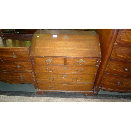 751 - A Georgian oak bureau with a fall front enclosing fitted interior, with 2 short and 3 long drawers u... 