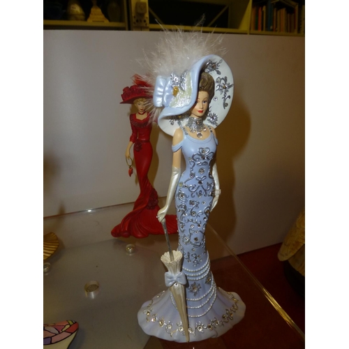 616 - 4 Thomas Kinkade figures of elegant ladies