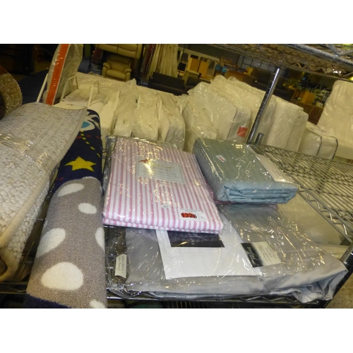 1364 - A quantity of various items including duvet covers, curtains, floor rugs, a bean bag etc. Contents o... 