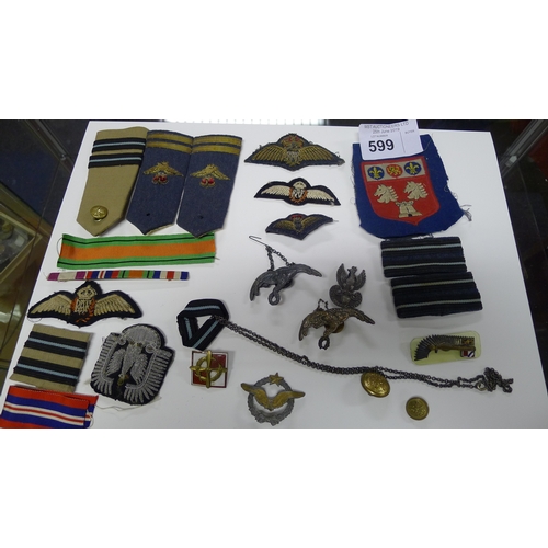 599 - A small quantity of various cap badges and military insignia relating to the Polish Free Airforce 30... 