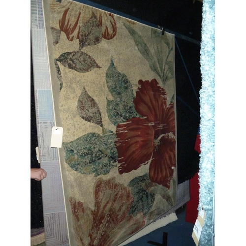 1475 - 1 square pattern floor rug RRP £64 and 1 leaf pattern floor rug RRP £80