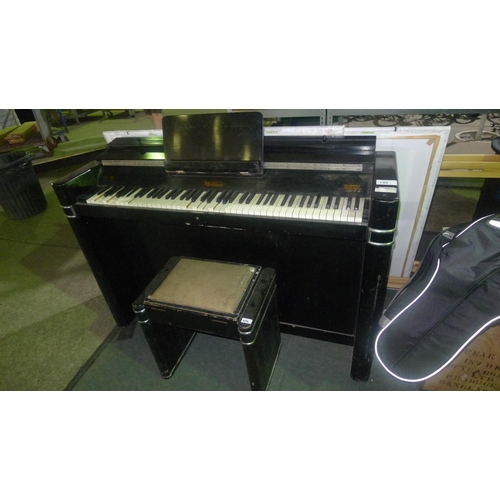 140 - A black lacquered Art Deco 1930s compact / mini piano by Eavestaff with matching piano stool