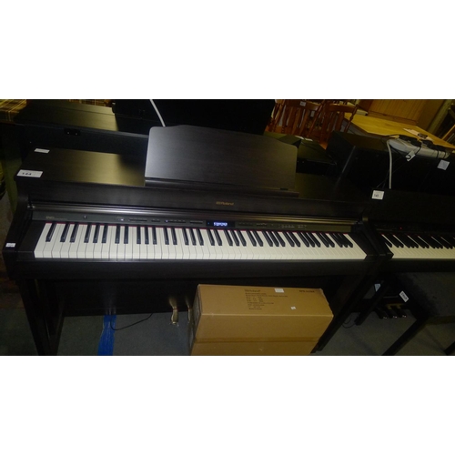 144 - 1 Roland digital electric piano type HP603A RRP £1,499 - comes with leads and piano stool - 240v tra... 