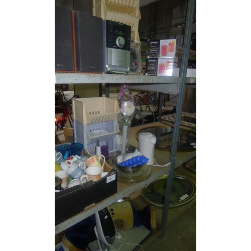 76 - A quantity of various items including crockery, a Sony hifi, a hand held vacuum cleaner etc. Content... 