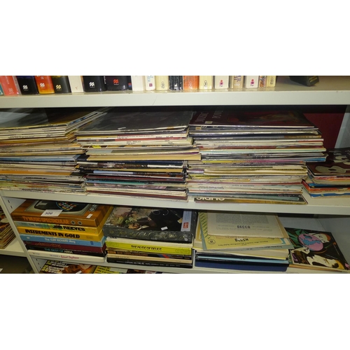 506 - A quantity of miscellaneous LP and single records (2 shelves)