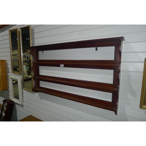 690 - A mahogany wall mounted plate rack