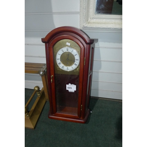 695 - A reproduction mahogany cased wall clock -