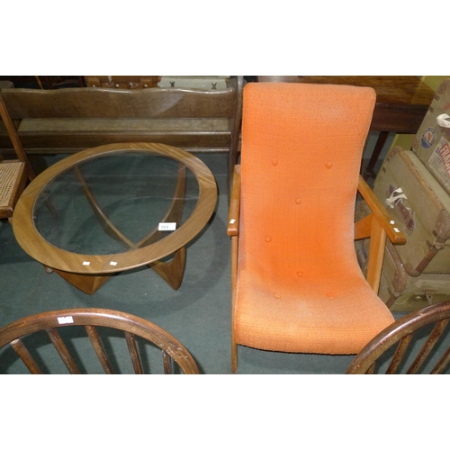 723 - A 1960s vintage armchair and a similar vintage circular topped coffee table