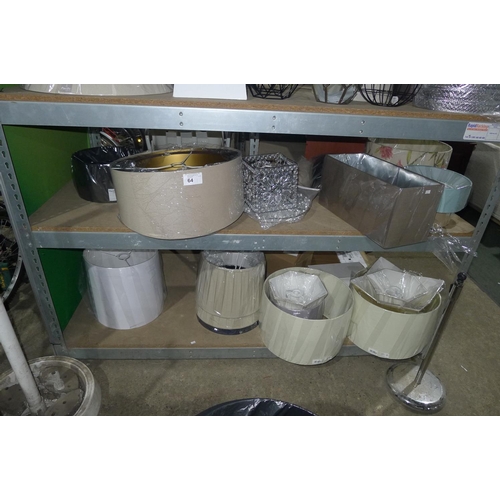 64 - A quantity of various lamp shades. Contents of two shelves