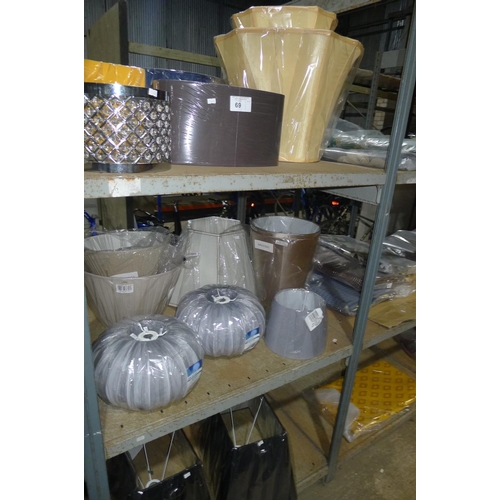 69 - A quantity of various lamp shades. Contents of one bay / 3 shelves