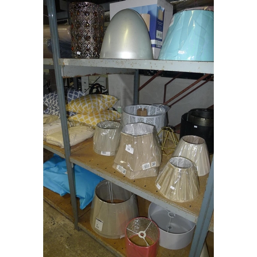 74 - A quantity of various lamp shades. Contents of one bay / 3 shelves