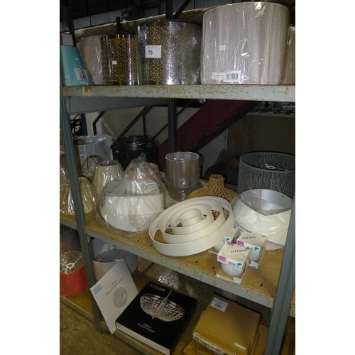 75 - A quantity of various lamp shades. Contents of one bay / 3 shelves