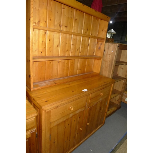 78 - A two part pine dresser with 2 open shelves above and 2 drawers / 2 doors below