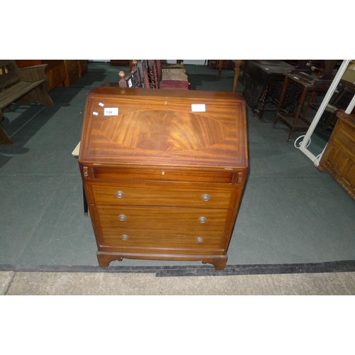 734 - A reproduction inlaid mahogany Bureau with a fall front and drawers under