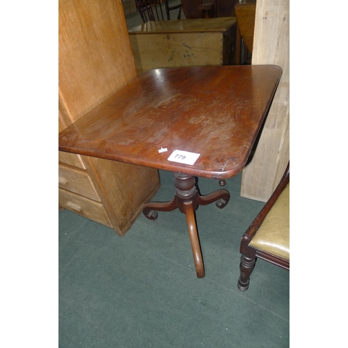 779 - A mahogany rectangular pedestal table with a tripod base