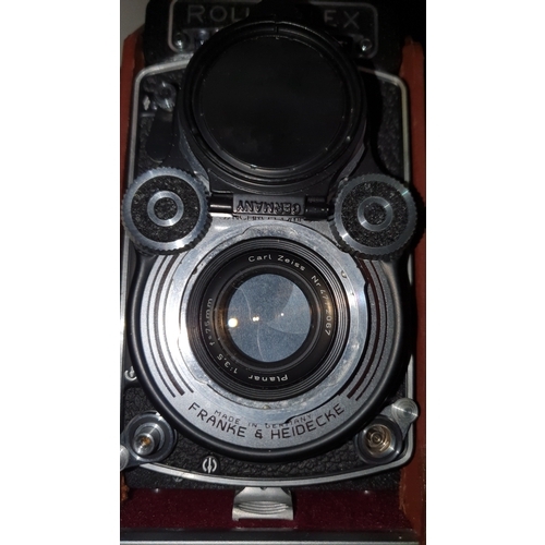 502 - A vintage Rolleiflex twin reflex  camera (DBP 3.5F 2828289 DBGM) leather case, lens covers, in good ... 