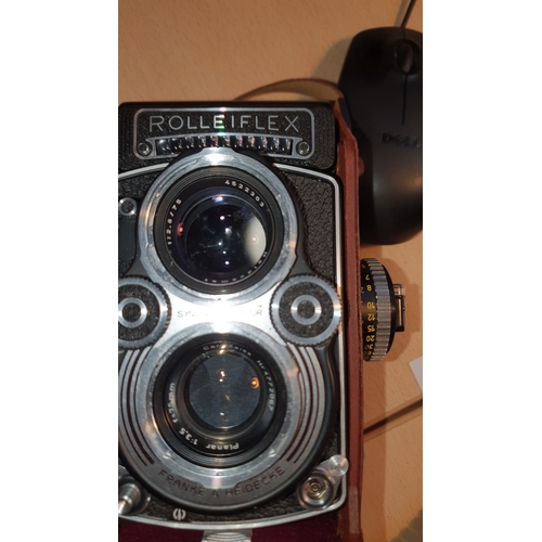 502 - A vintage Rolleiflex twin reflex  camera (DBP 3.5F 2828289 DBGM) leather case, lens covers, in good ... 