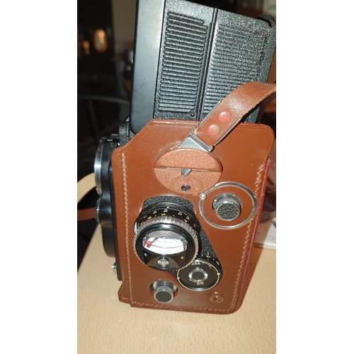 502 - A vintage Rolleiflex twin reflex  camera (DBP 3.5F 2828289 DBGM) leather case, lens covers, in good ... 