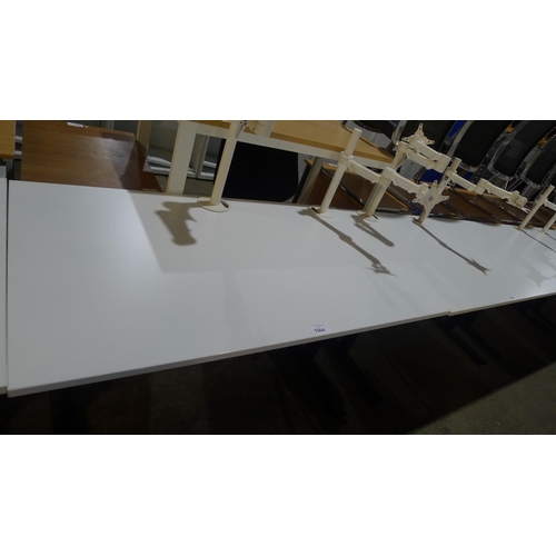 1064 - 1 white rectangular office table with 2 monitor support arms attached  (approx size 140x80cm) - NO p... 